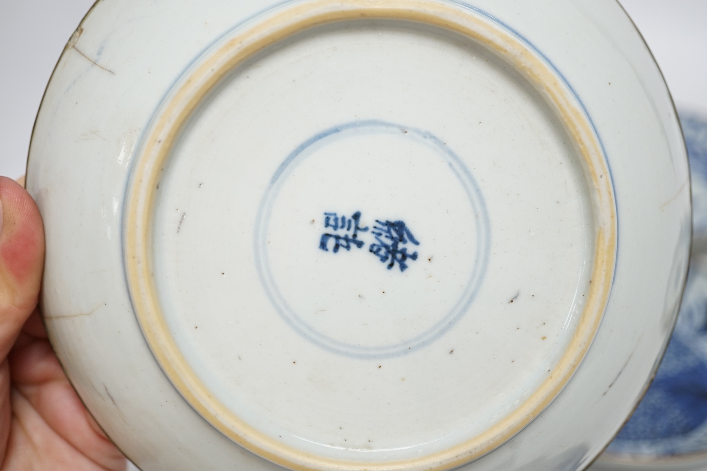 Five variously patterned Chinese blue and white saucer dishes, Kangxi period, largest 16cm diameter. Condition - chips and cracks to three items